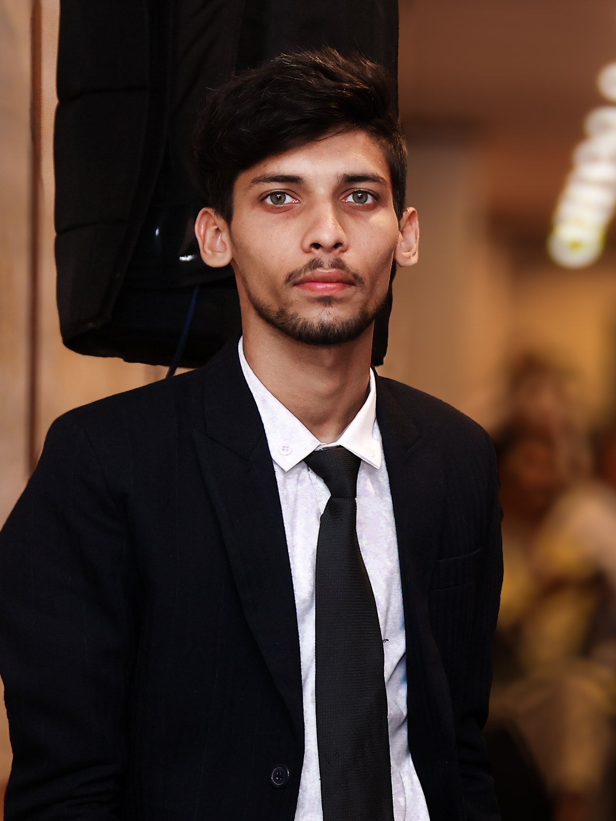 Abdul Rafay Amir, founder of RafayGen AI, in a dark suit and tie
